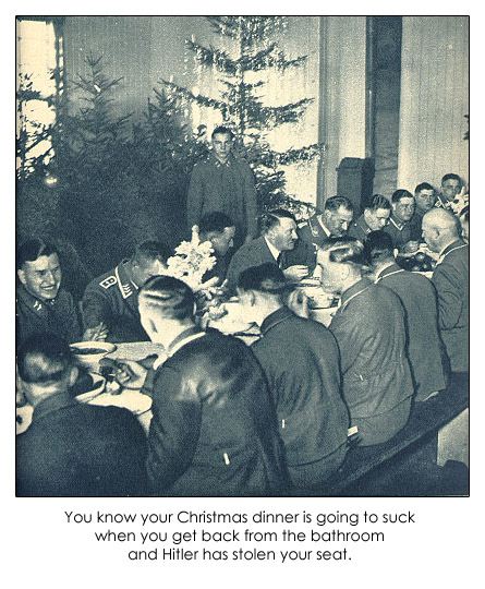 Picture of Nazis eating at a long table, with one man standing